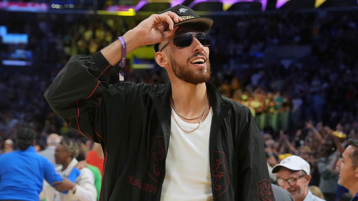 Thunder Chet Holmgren attends the game between the Dallas Wings and the LA Sparks at the Crypto.com Arena with Drew Hanlen in the background