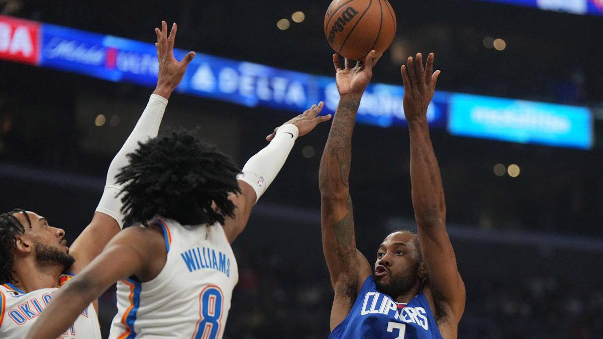 Clippers forward Kawhi Leonard (2) shoots the ball against Oklahoma City Thunder center Olivier Sarr (30) and forward Jalen Williams (8) in the first half at Crypto.com Arena
