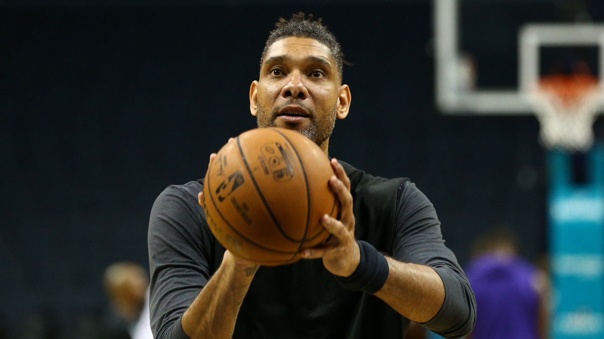 San Antonio Spurs former player Tim Duncan shoots the ball before a game against the Charlotte Hornets at Spectrum Center.
