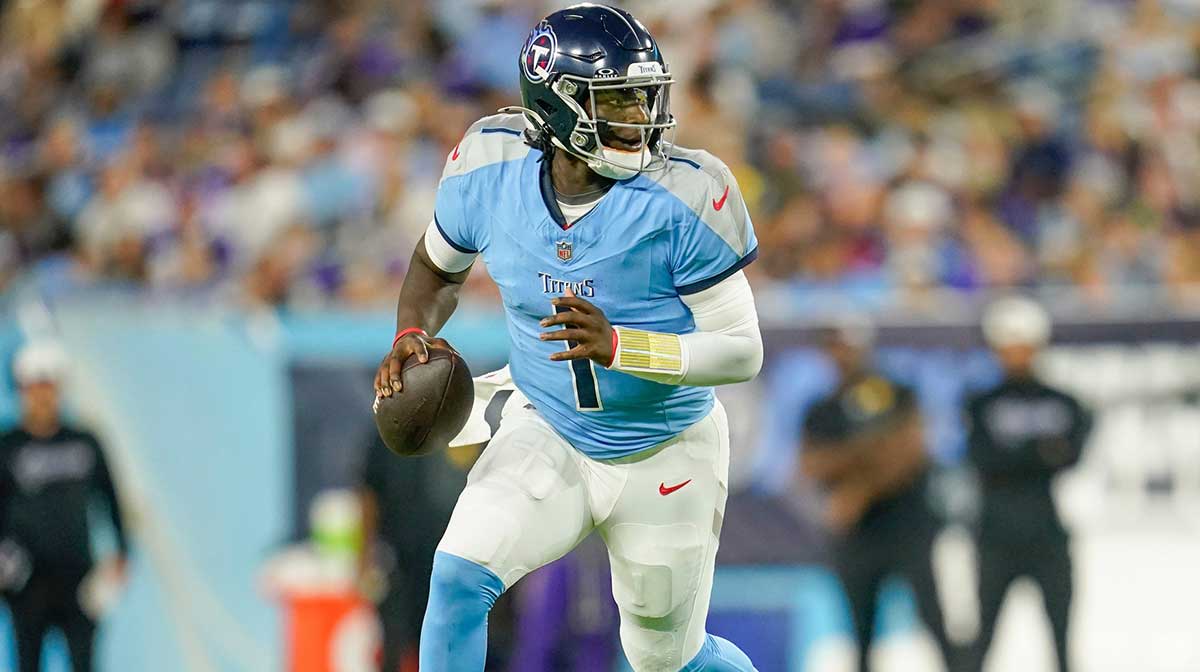 Tennessee Titans quarterback Cam Ward (1) runs the ball during the second quarter of an NFL pre-season game against the Minnesota Vikings at Nissan Stadium in Nashville, Tenn., Friday, Aug. 22, 2025.
