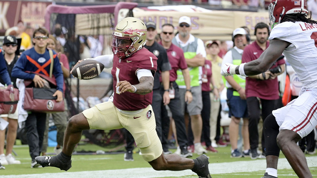 Florida State Seminoles quarterback Tommy Castellanos (1) runs for a touchdown against the Alabama Crimson Tide during the first half at Doak S. Campbell Stadium.