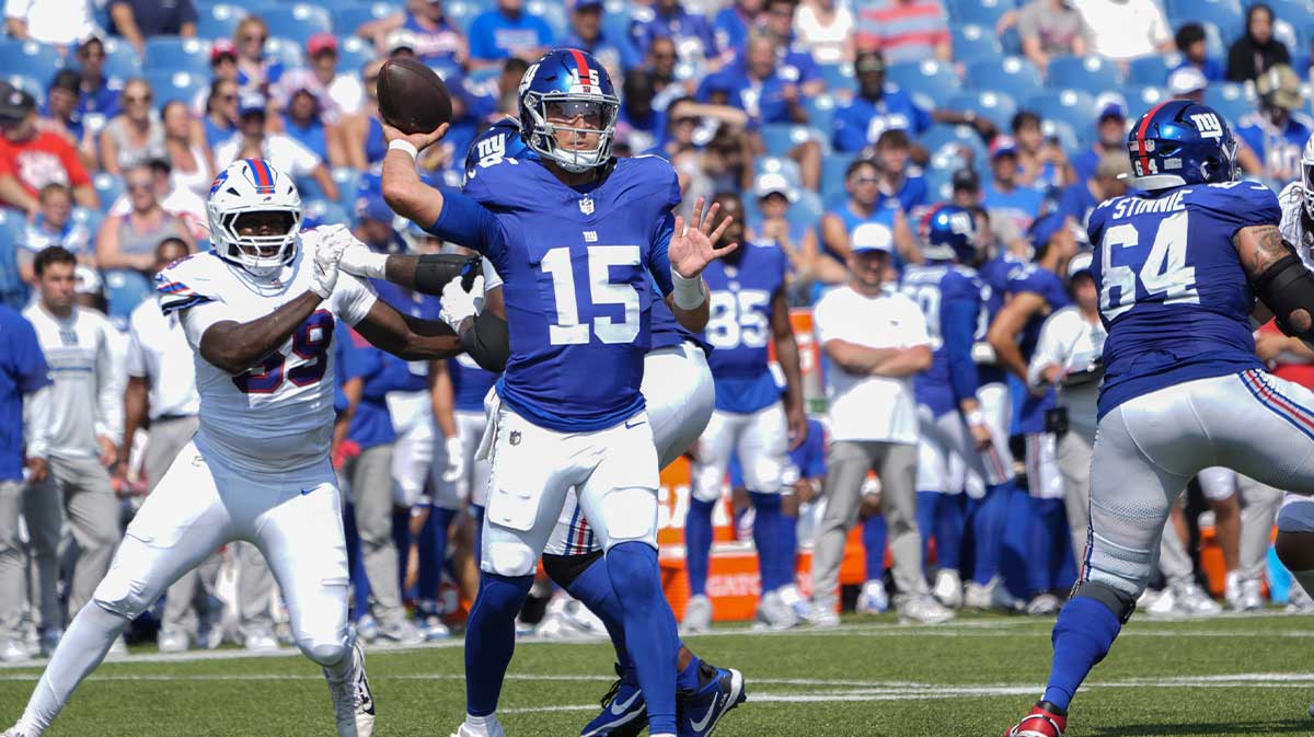 New York Giants quarterback Tommy DeVito (15) throws the ball against the Buffalo Bills during the second half at Highmark Stadium.