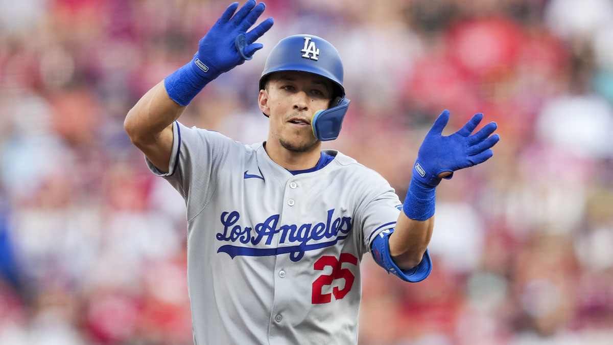 Los Angeles Dodgers second baseman Tommy Edman (25) gestures as he runs then bases after hitting a two-run home run against the Cincinnati Reds in the second inning at Great American Ball Park.