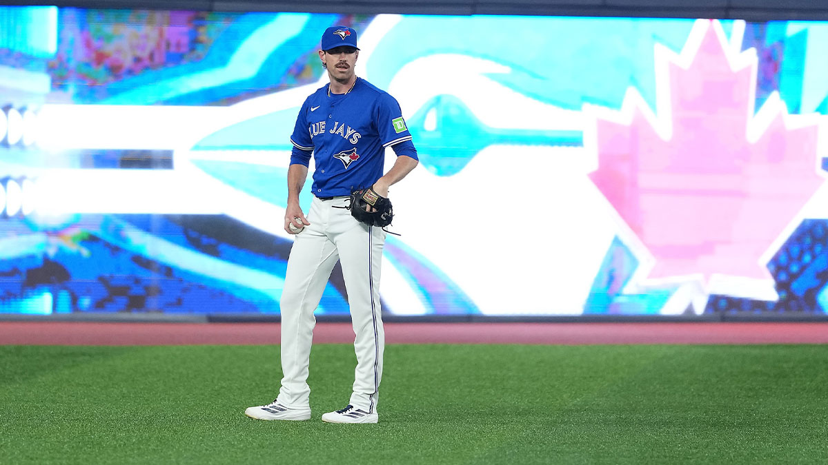 Toronto Blue Jays pitcher Shane Bieber (57) takes a break during batting practice before a game against the Chicago Cubs at Rogers Centre.