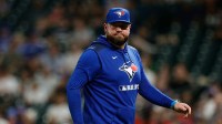 Toronto Blue Jays manager John Schneider (14) in the sixth inning against the Colorado Rockies at Coors Field.