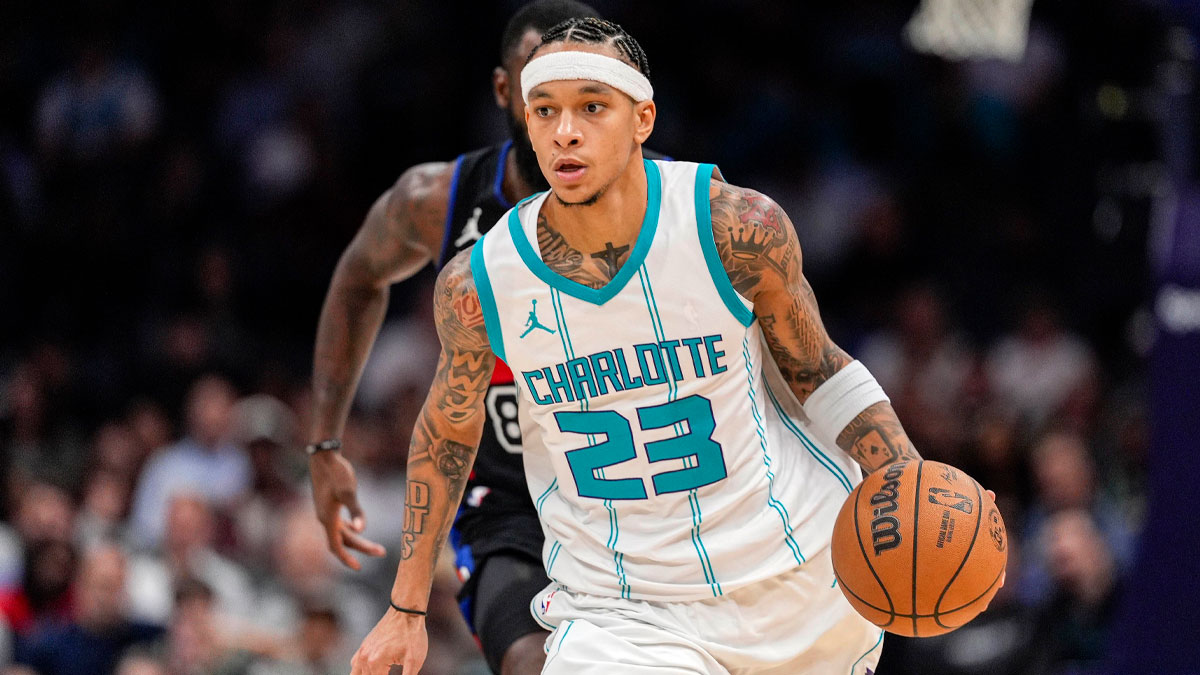Charlotte Hornets guard Tre Mann (23) handles the ball against the Detroit Pistons during the second half at Spectrum Center.