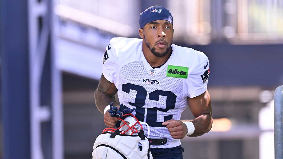 New England Patriots running back TreVeyon Henderson (32) heads to the practice fields for training camp at Gillette Stadium.