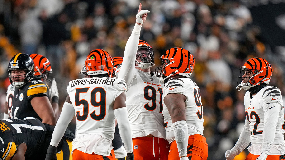 Cincinnati Bengals defensive end Trey Hendrickson (91) celebrates after sacking Pittsburgh Steelers quarterback Russell Wilson (3) in the first quarter of the NFL Week 18 game between the Pittsburgh Steelers and the Cincinnati Bengals at Acrisure Stadium in Pittsburgh on Saturday, Jan. 4, 2025.
