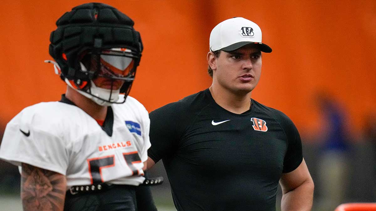 Cincinnati Bengals defensive end Trey Hendrickson (91) assists with drills during a preseason training camp practice in downtown Cincinnati on Thursday, July 31, 2025.