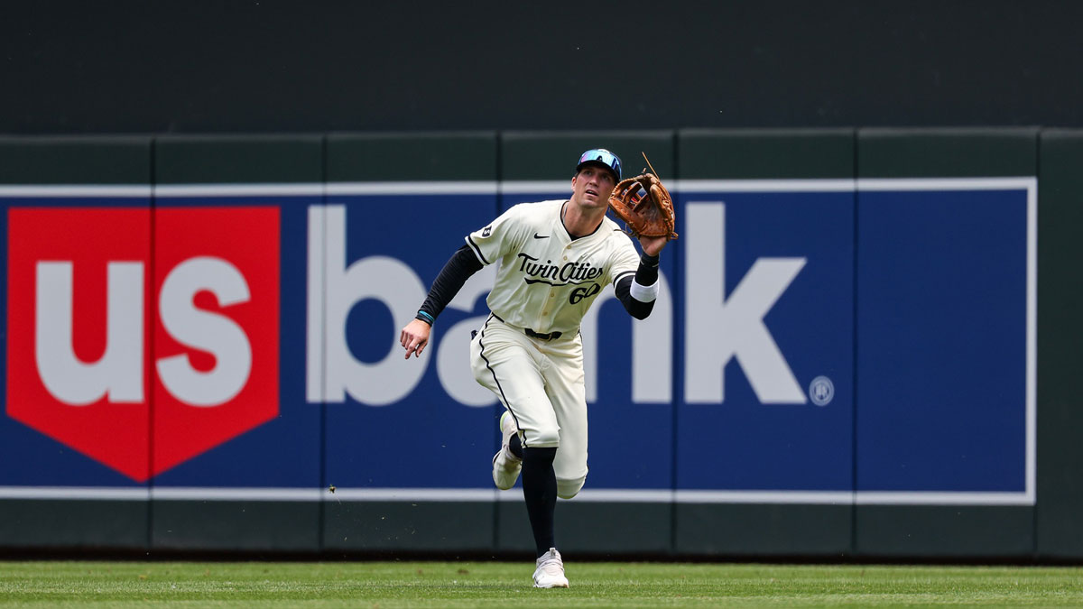 Minnesota Twins right fielder Carson McCusker (60) catches a fly ball hit by Kansas City Royals catcher Freddy Fermin (34) during the fifth inning at Target Field.
