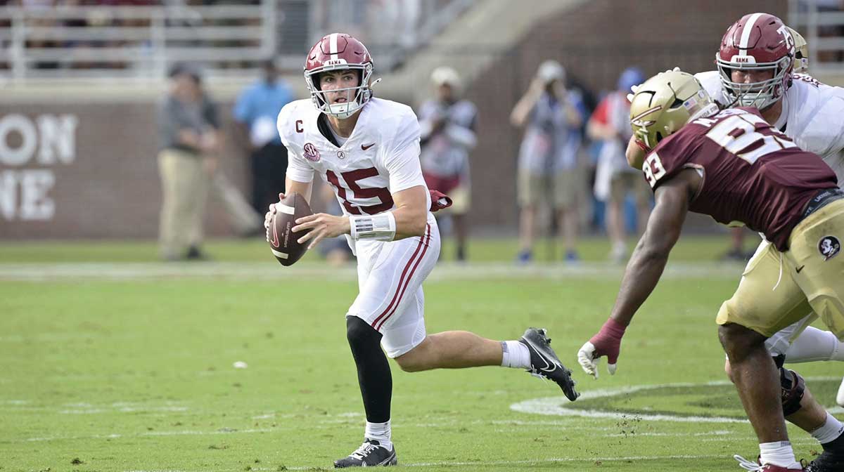 Alabama Crimson Tide quarterback Ty Simpson (15) looks to pass the ball against the Florida State Seminoles during the second half at Doak S. Campbell Stadium.