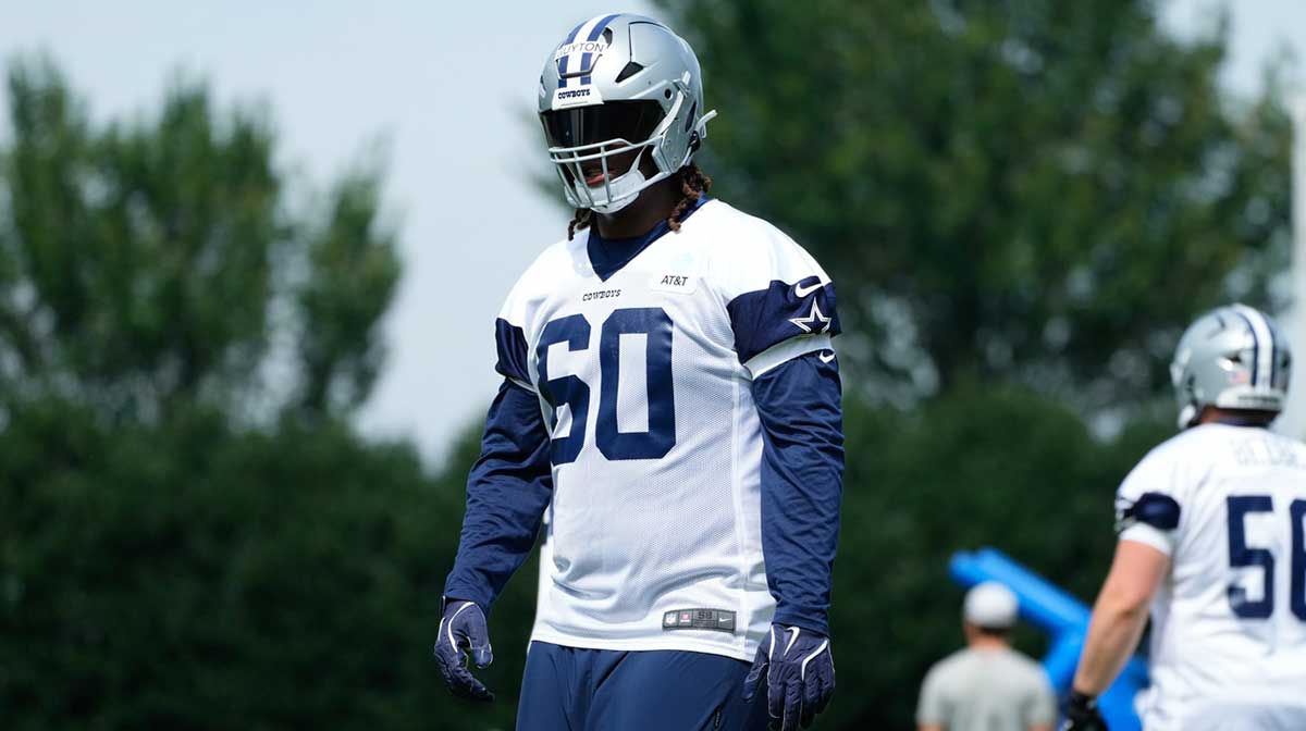 Dallas Cowboys tackle Tyler Guyton (60) goes through a drill during practice at the Ford Center at the Star Training Facility in Frisco, Texas.
