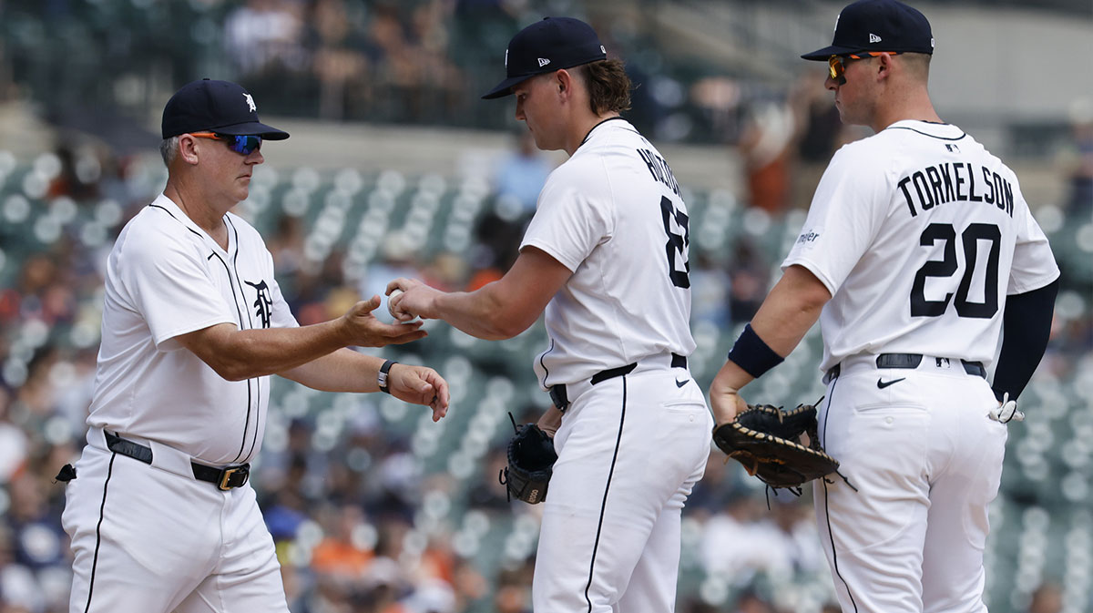 Detroit Tigers manager A.J. Hinch (14) take the ball to relieve pitcher Tyler Holton (87) in the sixth inning against the Minnesota Twins at Comerica Park.