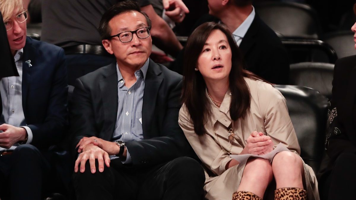 Taiwanese businessman Joe Tsai (left) looks on during the second half of the preseason WNBA game between the New York Liberty and the China National Team at Barclays Center.