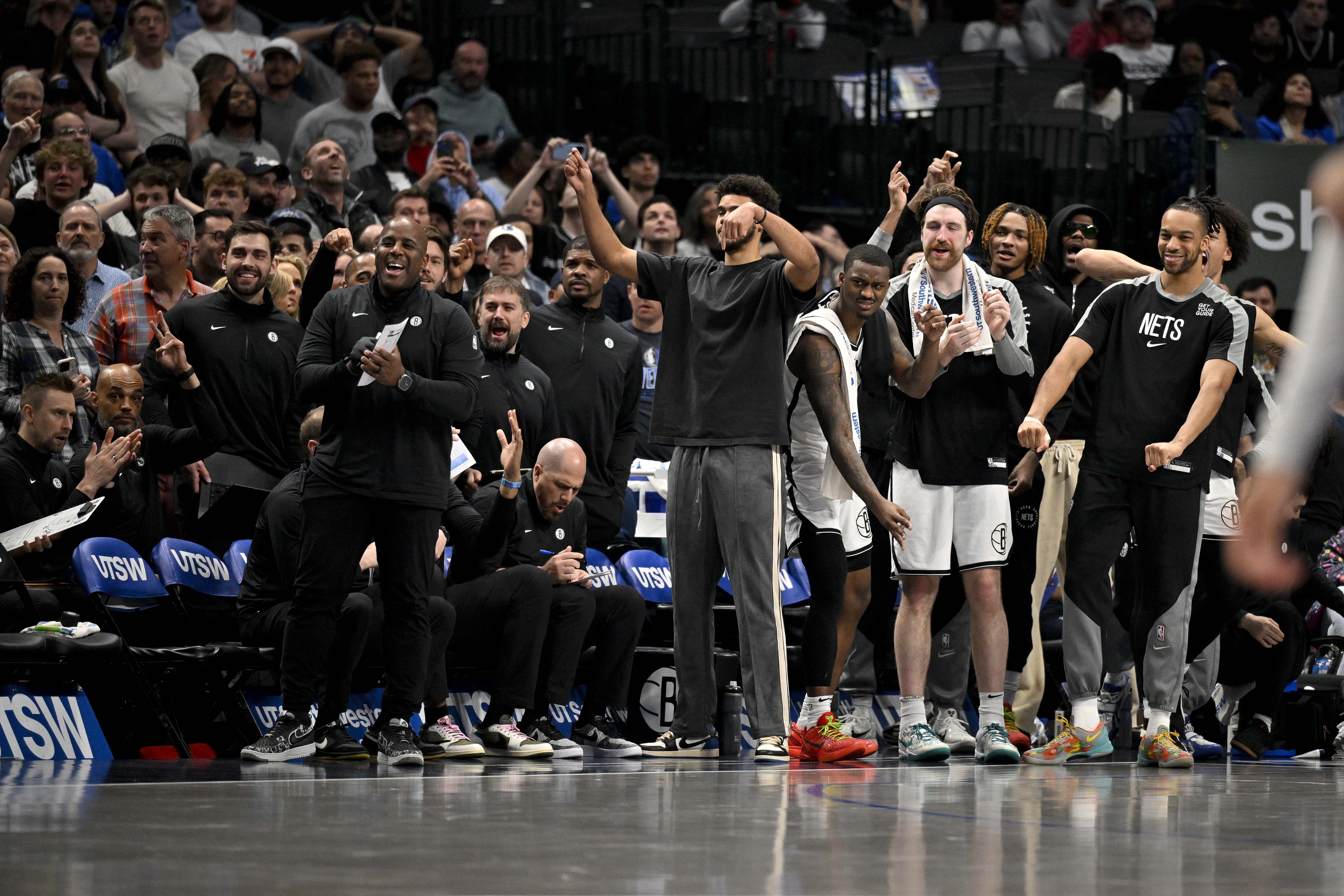 The Brooklyn Nets team bench celebrate during the second half of the game against the Brooklyn Nets at the American Airlines Center.