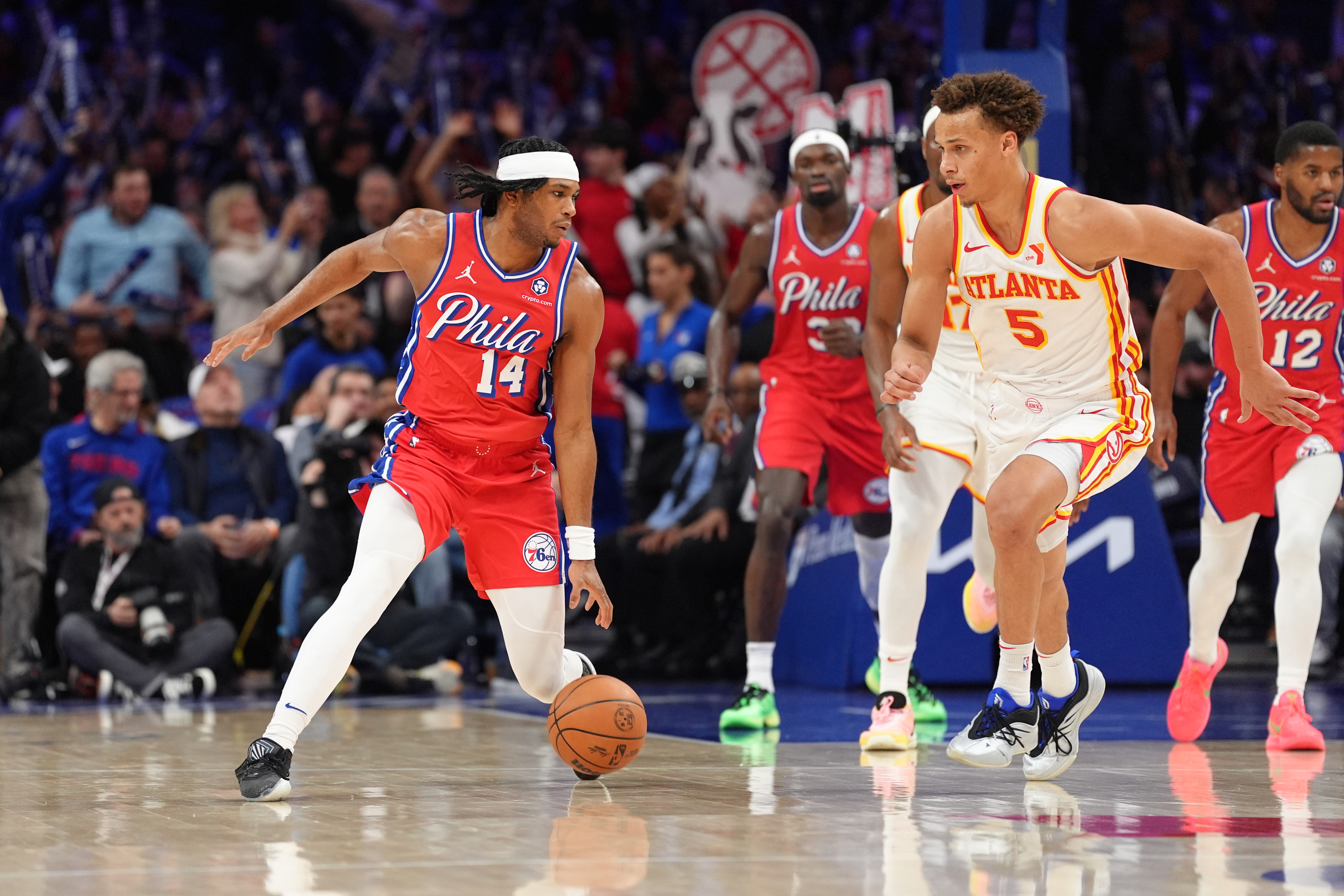 Philadelphia 76ers guard Ricky Council IV (14) controls the ball against Atlanta Hawks guard Dyson Daniels (5) in the third quarter at Wells Fargo Center.