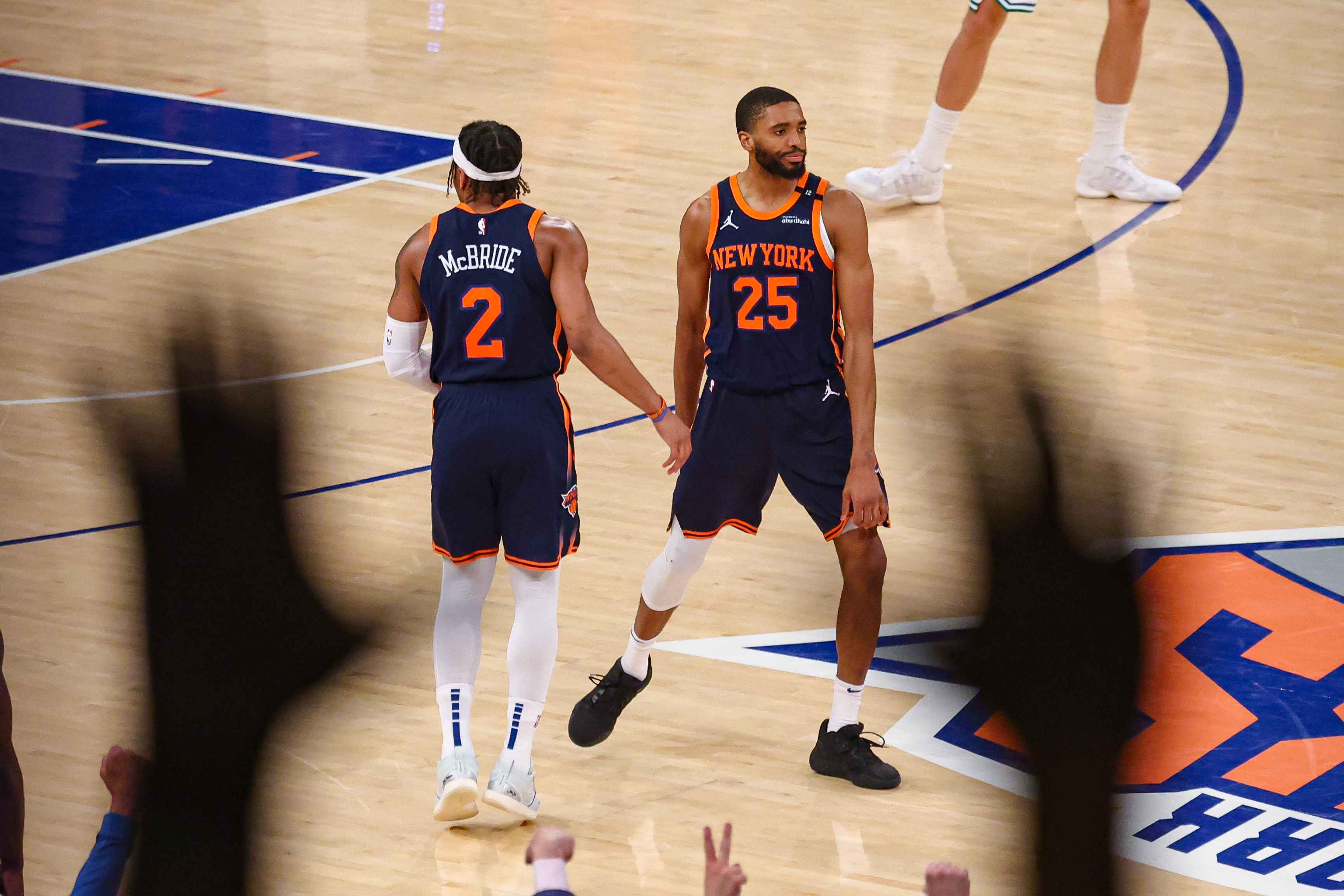 New York Knicks forward Mikal Bridges (25) and guard Miles McBride (2) celebrates after a basket in the second half during game four of the second round for the 2025 NBA Playoffs against the Boston Celtics at Madison Square Garden.