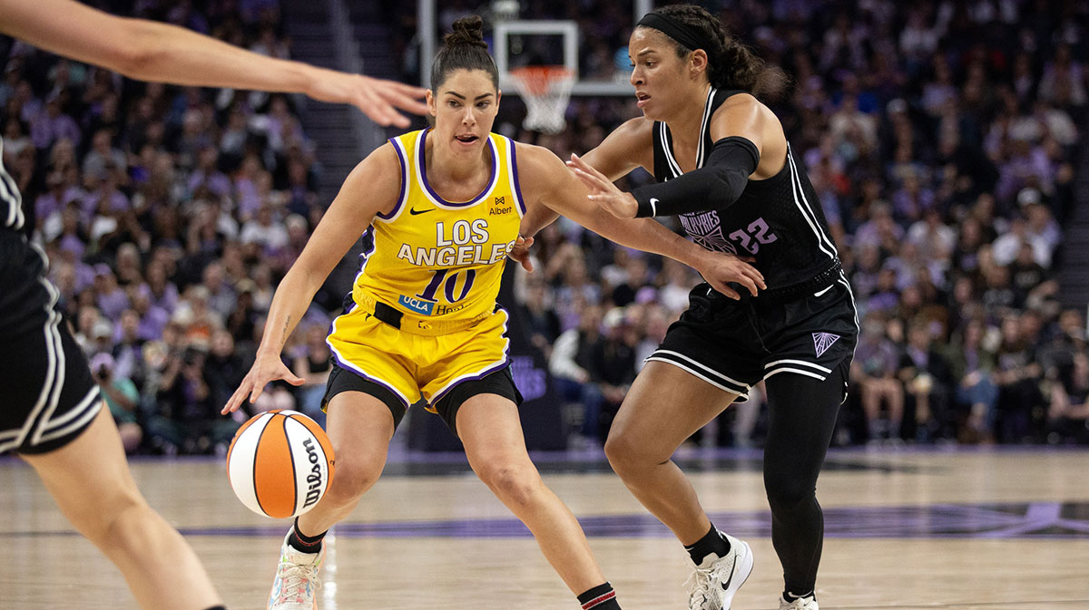 Los Angeles Sparks guard Kelsey Plum (10) dribbles around Golden State Valkyries guard Veronica Burton (22) during the fourth quarter at Chase Center.