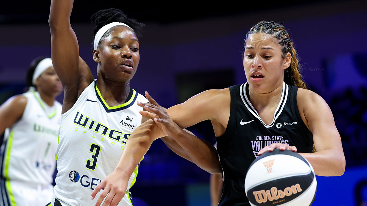 Golden State Valkyries guard Veronica Burton (22) drives to the basket as Dallas Wings guard Kaila Charles (3) defends during the first half at College Park Center.