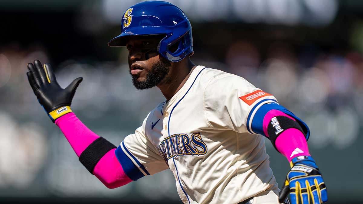 Seattle Mariners right fielder Victor Robles (10) celebrates at second base after hitting a two-run single during the third inning against the Athletics at T-Mobile Park.