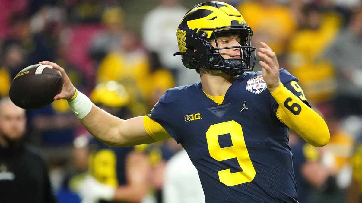 Michigan quarterback JJ McCarthy (9) throws a pass during the pregame before the Fiesta Bowl at State Farm Stadium. Ncaa Fiesta Bowl Game. Vikings rookie JJ McCarthy faces ups and downs in NFL Training Camp as he works on touch, technique, and consistency.