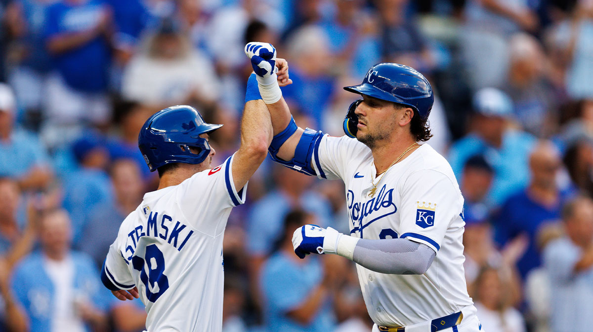 Kansas City Royals first base Vinnie Pasquantino (9) celebrates with Kansas City Royals outfielder Mike Yastrzemski (18) after scoring during the first inning against the Texas Rangers at Kauffman Stadium.