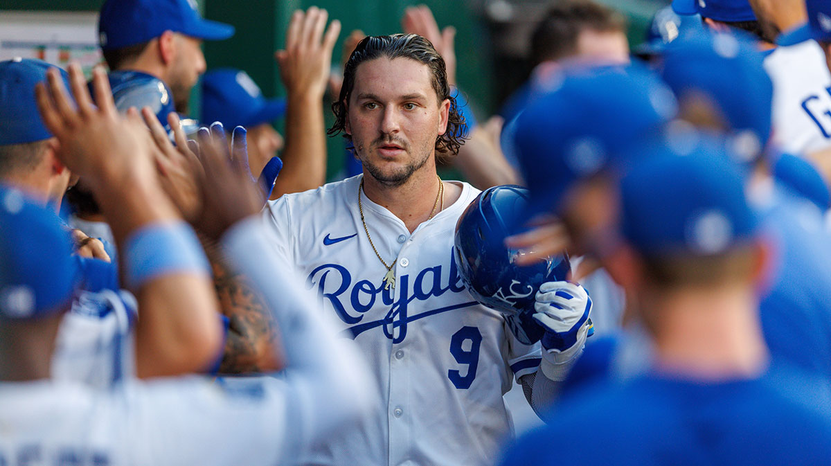 Kansas City Royals first base Vinnie Pasquantino (9) celebrates in the dugout after hitting a home run during the first inning against the Texas Rangers at Kauffman Stadium.