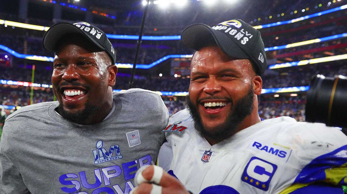 Los Angeles Rams outside linebacker Von Miller (left) and defensive end Aaron Donald celebrate after defeating the Cincinnati Bengals in Super Bowl LVI at SoFi Stadium.