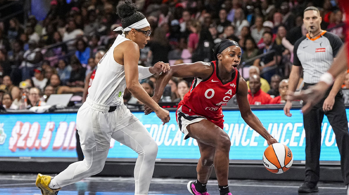 Las Vegas Aces guard Jackie Young (0) dribbles against Atlanta Dream guard Allisha Gray (15) during the first half at Gateway Center Arena at College Park.