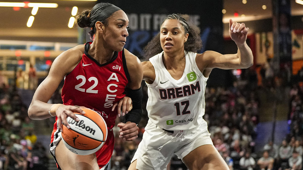 Las Vegas Aces center A'ja Wilson (22) dribbles against Atlanta Dream forward Nia Coffey (12) during the first half at Gateway Center Arena at College Park.