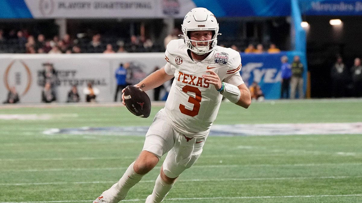 Texas Longhorns quarterback Quinn Ewers (3) runs with the ball for a touchdown against the Arizona State Sun Devils during the second half of the Peach Bowl at Mercedes-Benz Stadium.