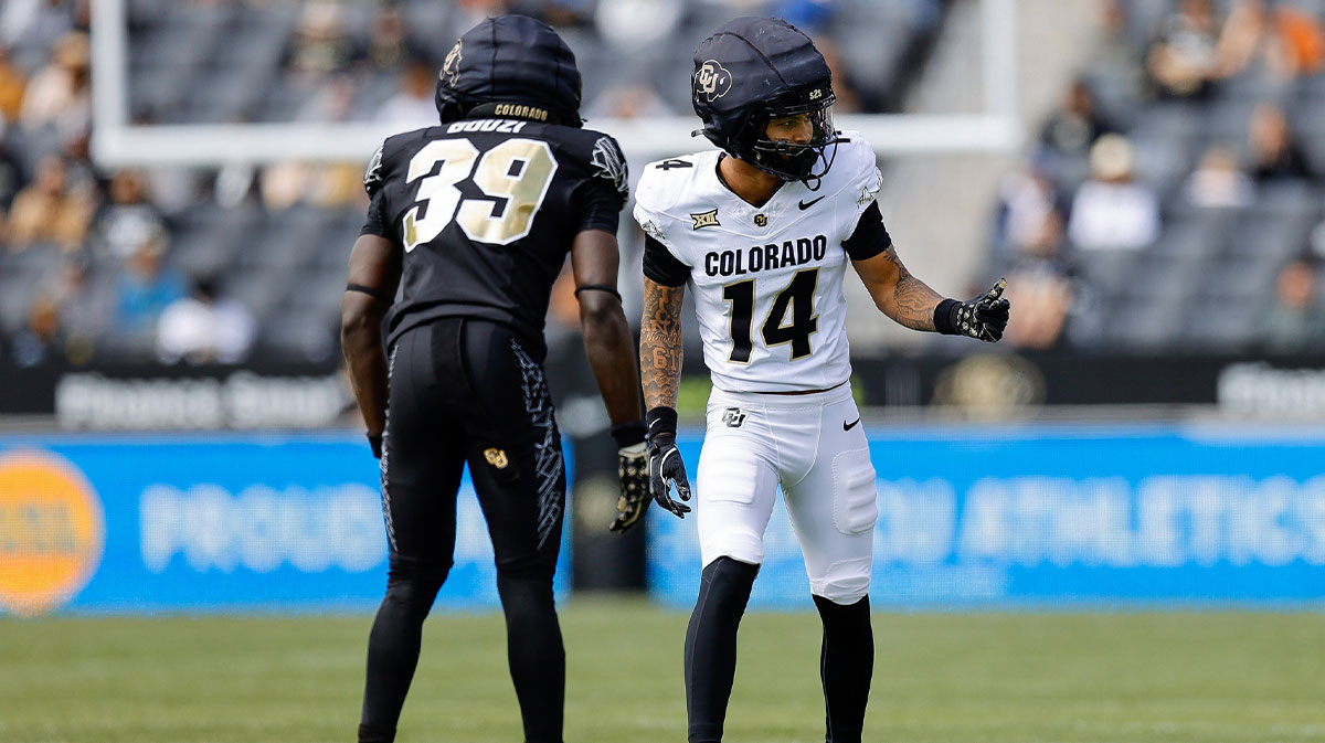 Colorado Buffaloes wide receiver Quanell Farrakhan Jr. (14) and cornerback Ben Bouzi (39) during the spring game at Folsom Field.