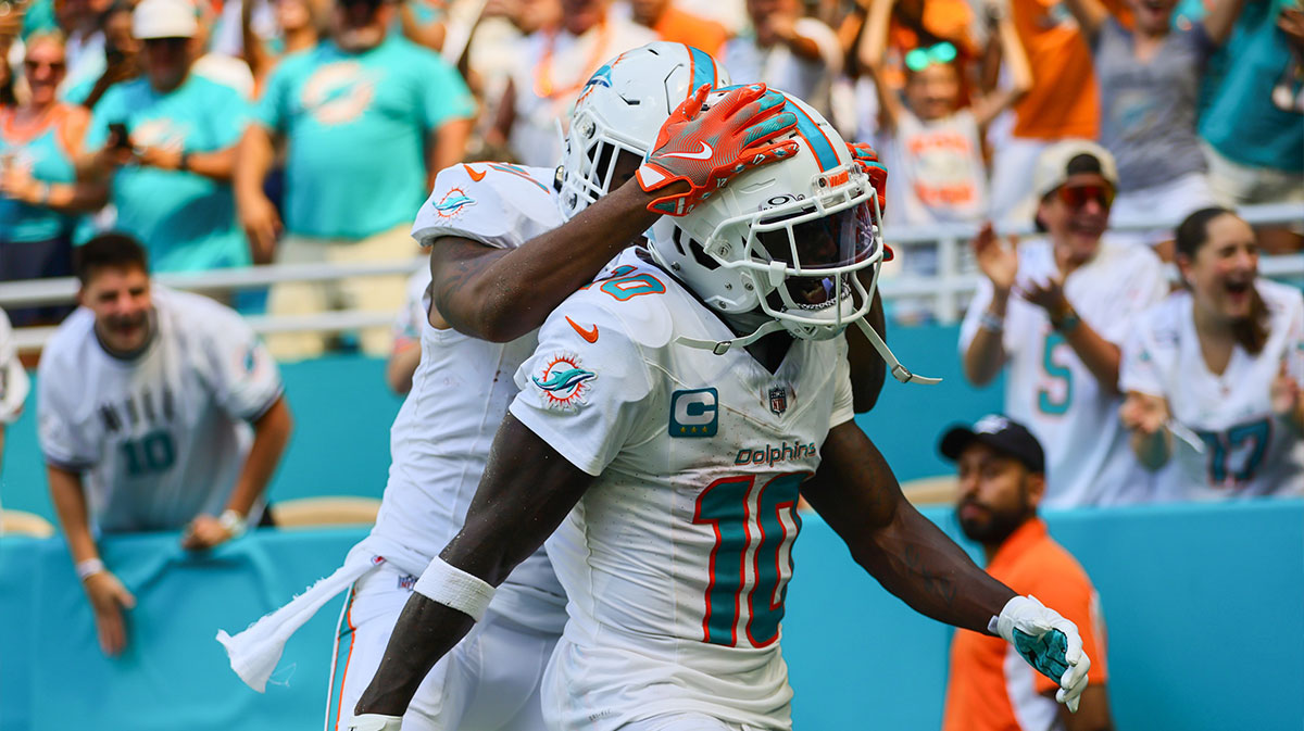 Miami Dolphins wide receiver Tyreek Hill (10) celebrates with wide receiver Jaylen Waddle (17) after scoring a touchdown against the Jacksonville Jaguars during the third quarter at Hard Rock Stadium.