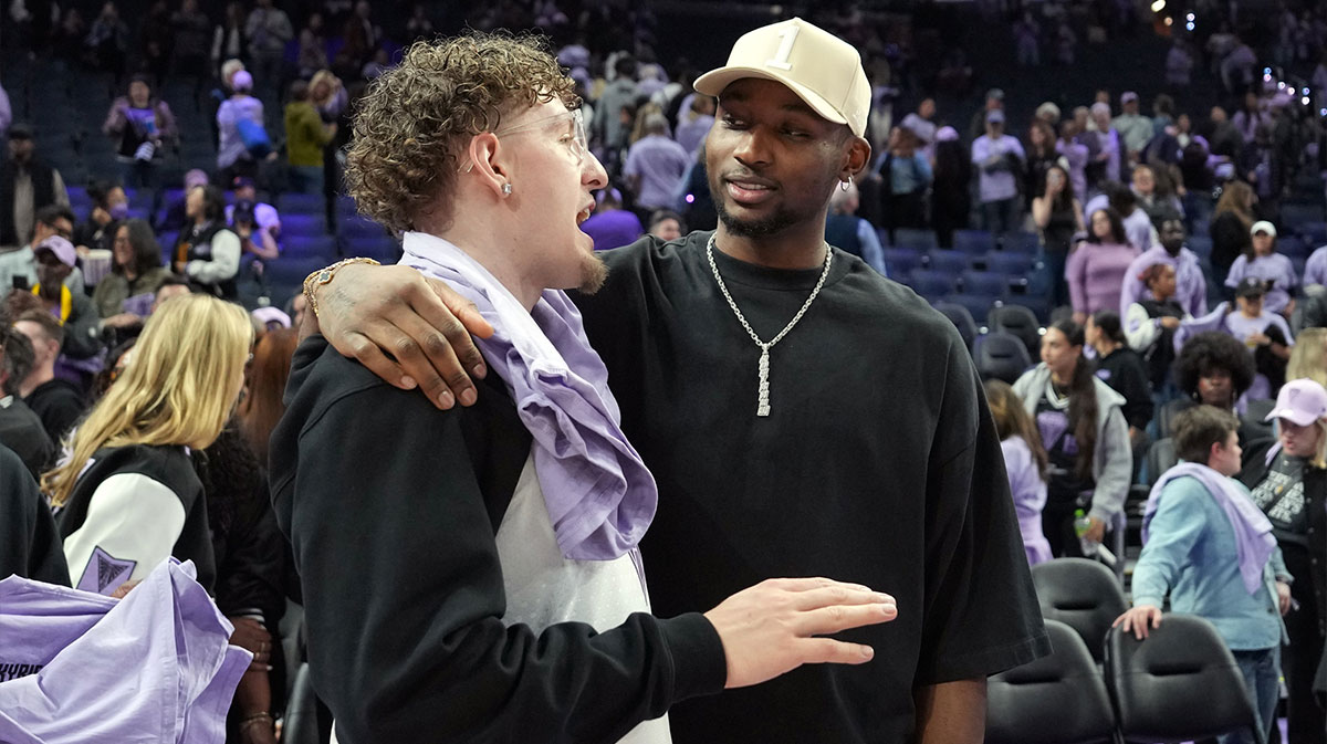 Golden State Warriors guard Brandin Podziemski (left) and Jonathan Kuminga (right) talk after the game between the Golden State Valkyries and the Los Angeles Sparks at Chase Center.