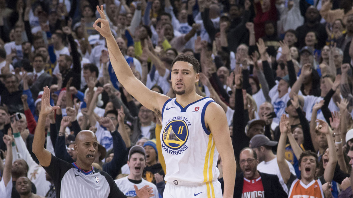 Golden State Warriors guard Klay Thompson (11) celebrates after making a three-point basket against the Cleveland Cavaliers during the fourth quarter at Oracle Arena.