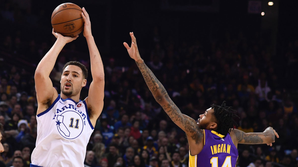 Golden State Warriors guard Klay Thompson (11) shoots the basketball against Los Angeles Lakers forward Brandon Ingram (14) during the first quarter at Oracle Arena.