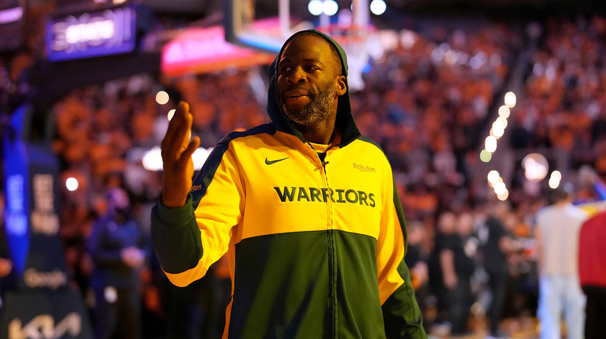 Warriors forward Draymond Green (23) blows a kiss towards the crowd before the start of the game against the Minnesota Timberwolves during game four of the second round for the 2025 NBA Playoffs at Chase Center with Packers' Micah Parsons in the background