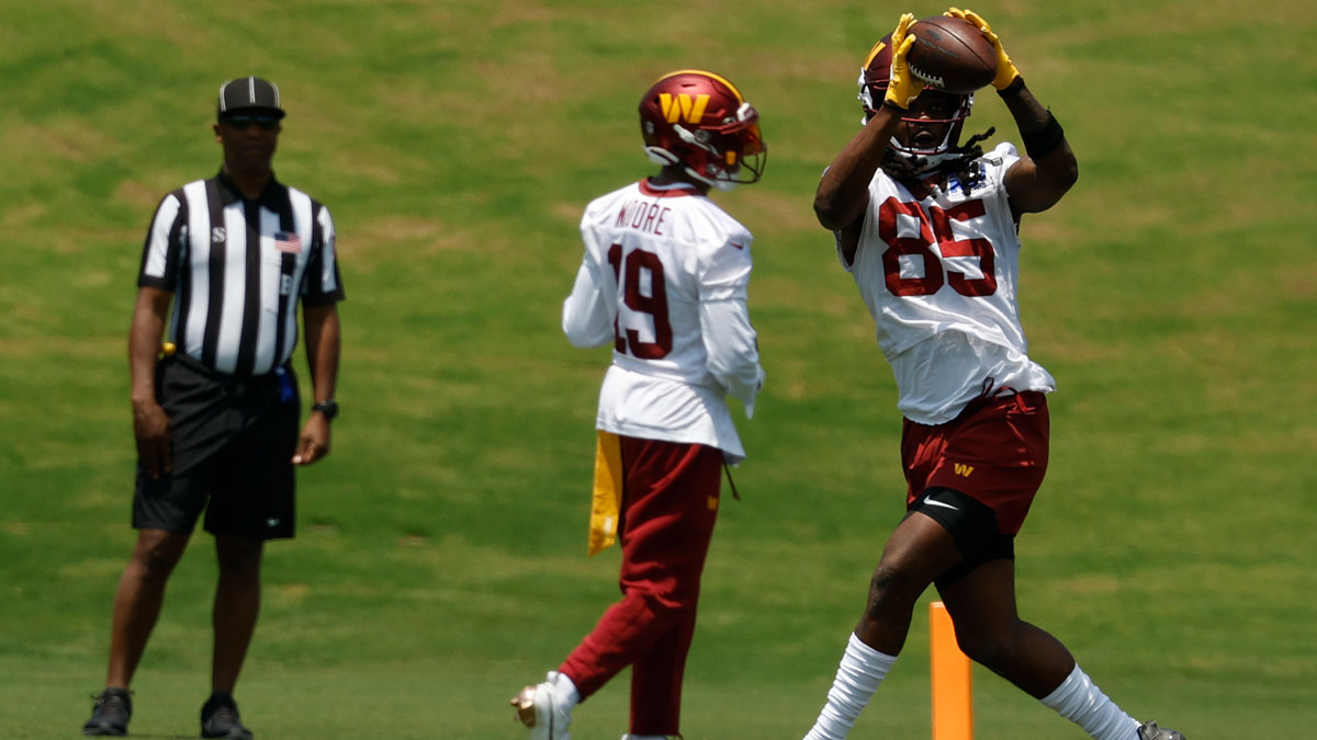 Washington Commanders wide receiver Noah Brown (85) catches a pass during drills on day one of minicamp at Commanders Park.