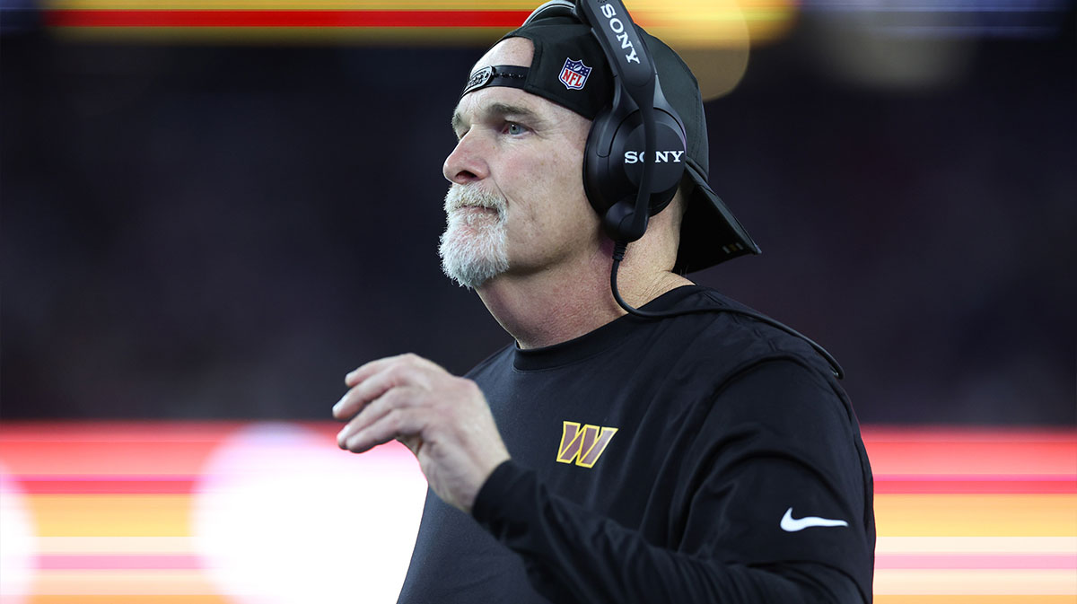 Washington Commanders head coach Dan Quinn reacts during the first half against the New England Patriots at Gillette Stadium.