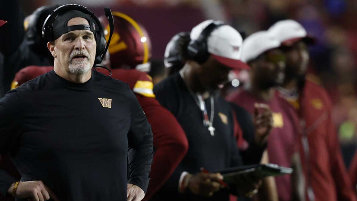 Washington Commanders head coach Dan Quinn looks on from the sidelines against the Cincinnati Bengals during the first quarter at Northwest Stadium.