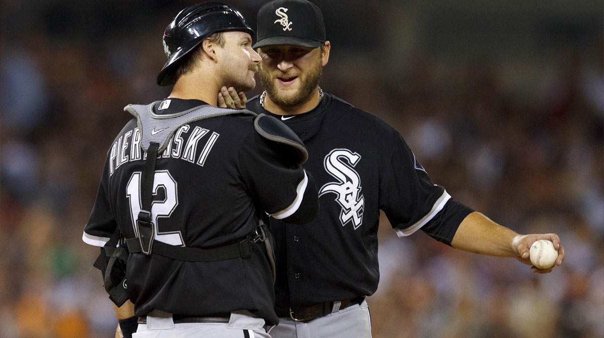 Chicago White Sox catcher A.J. Pierzynski (12) talks to starting pitcher Mark Buehrle (right) during the game against the Detroit Tigers at Comerica Park.