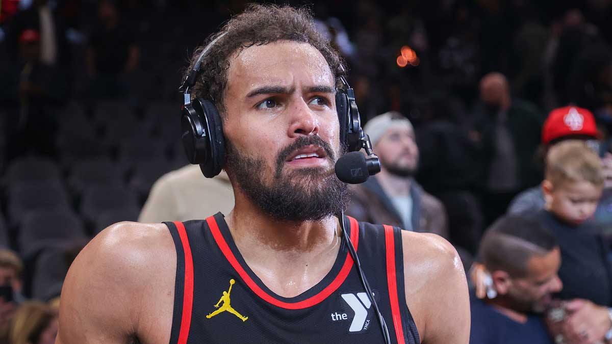 Atlanta Hawks guard Trae Young (11) does an interview after a victory over the Indiana Pacers at State Farm Arena.