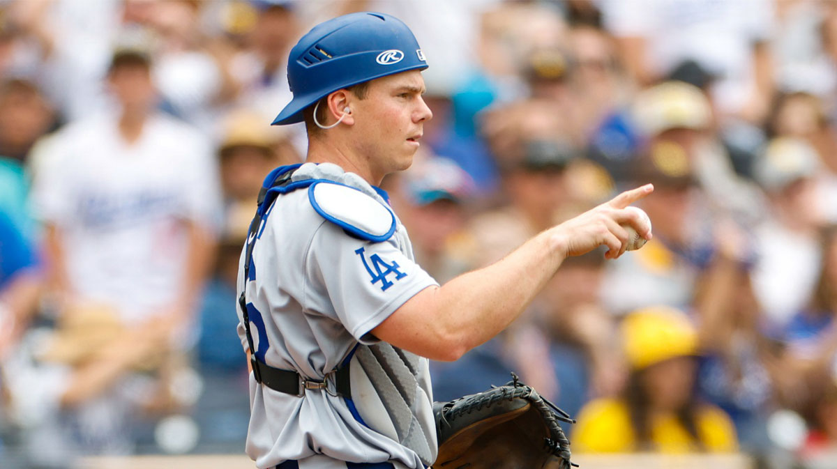 Los Angeles Dodgers catcher Will Smith (16) points to Los Angeles Dodgers center fielder Andy Pages (44) after throwing out San Diego Padres left fielder Gavin Sheets (30) attempting to score during the second inning against the San Diego Padres at Petco Park.