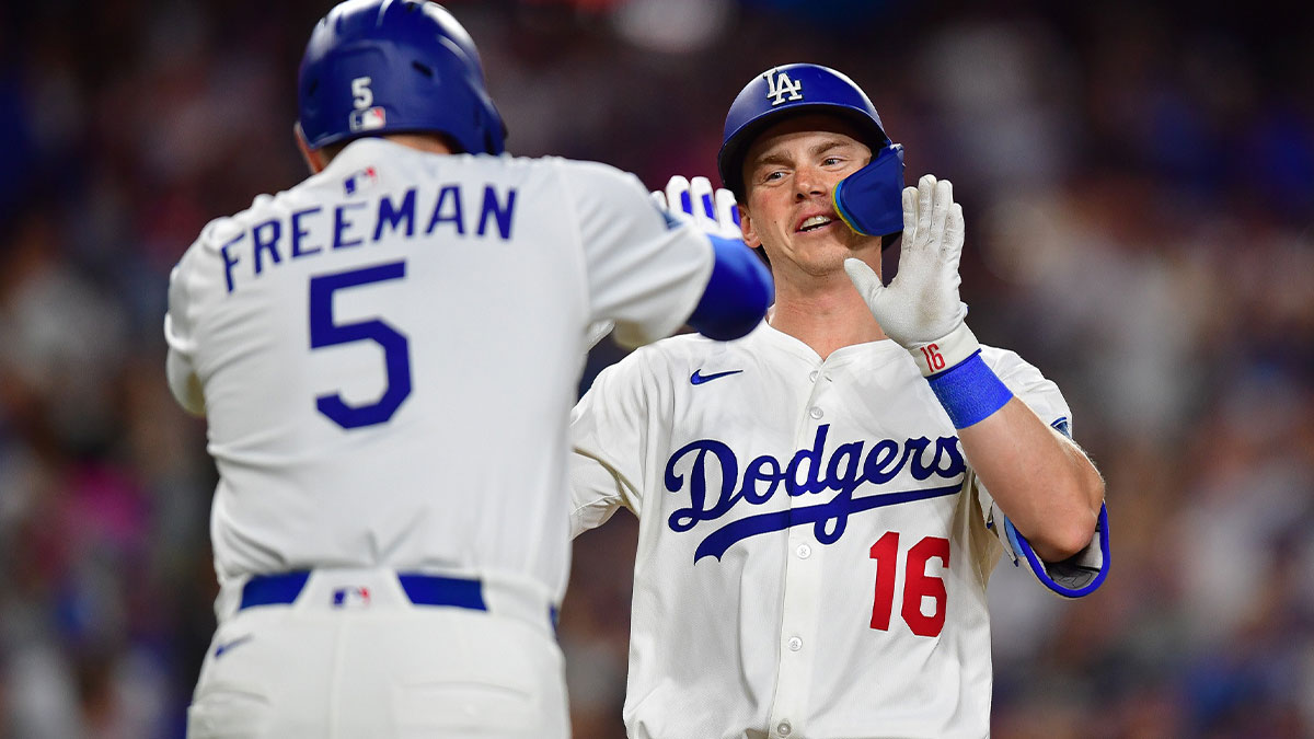 Los Angeles Dodgers catcher Will Smith (16) is greeted by first baseman Freddie Freeman (5) after hitting a solo home run against the Minnesota Twins during the sixth inning at Dodger Stadium.
