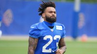 Los Angeles Rams running back Kyren Williams (23) runs out to the practice field during organized team activities at Rams Practice Facility.