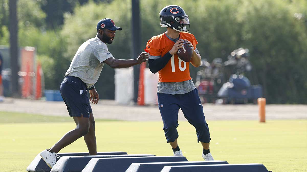 Chicago Bears quarterback Caleb Williams (18) looks to pass the ball during training camp at Halas Hall