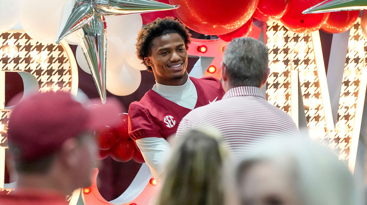 Alabama Crimson Tide players and coaches participate in a media day with reporters and fans at the Hank Crisp Indoor Practice Facility. Wide receiver Ryan Williams greets fans as they come up to have a photo taken with him.