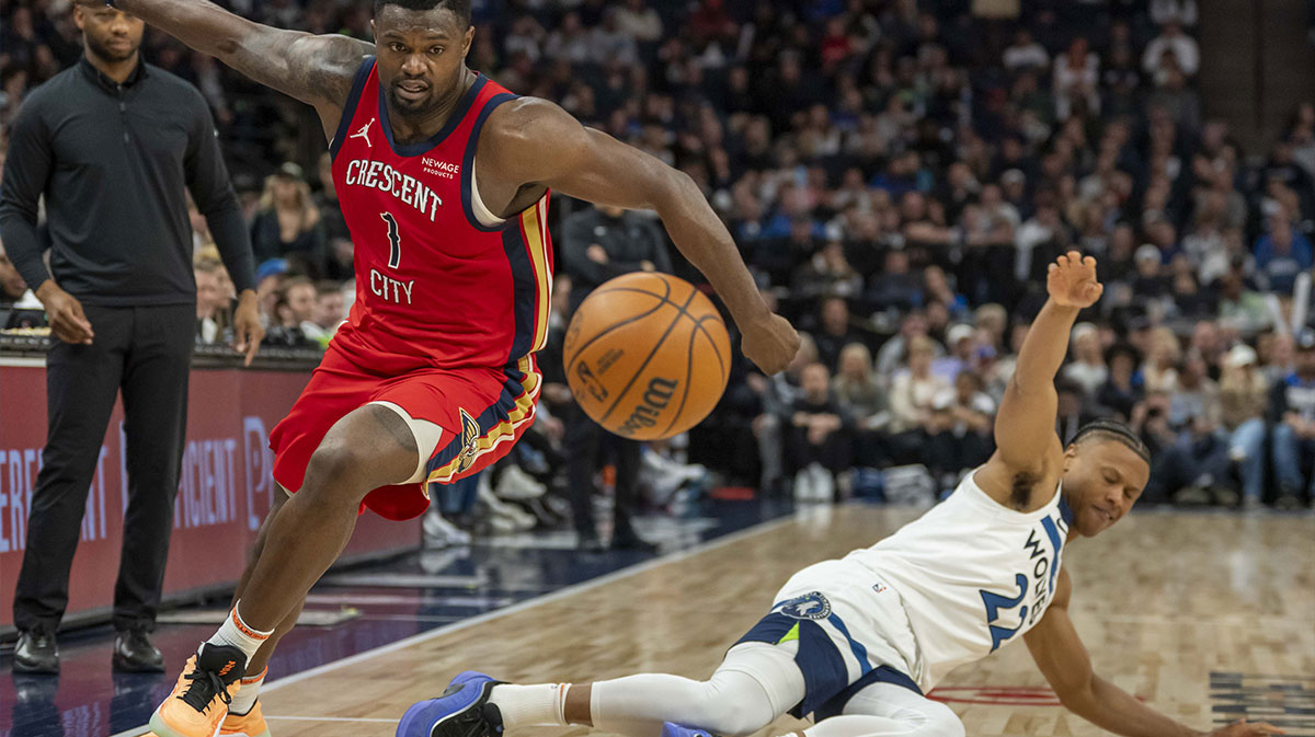 New Orleans Pelicans forward Zion Williamson (1) and Minnesota Timberwolves guard Jaylen Clark (22) attempt to go after a loose ball in the second half at Target Center.