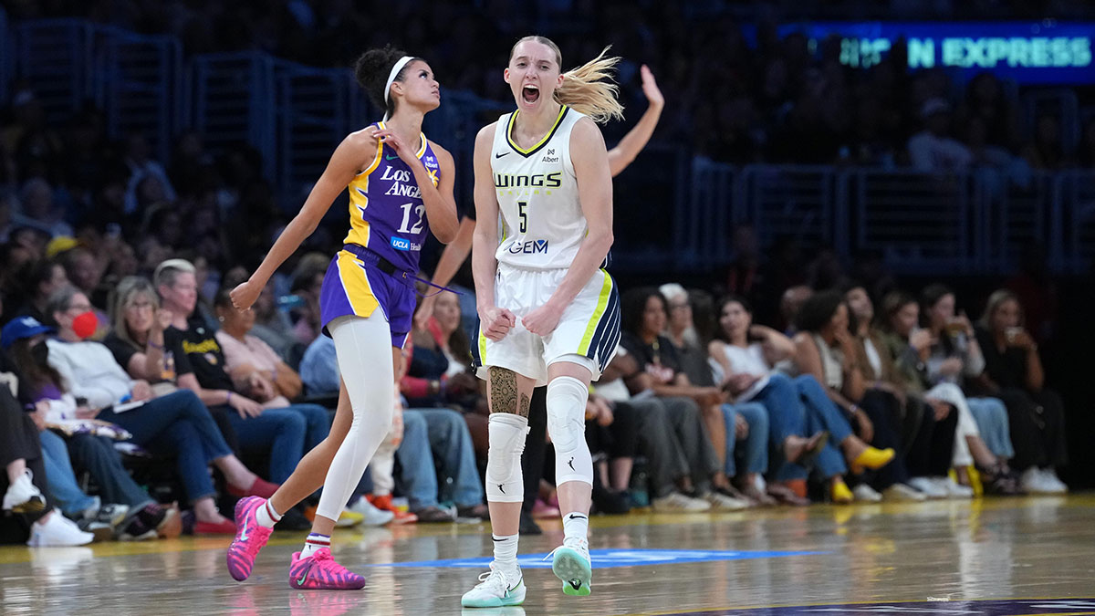 Wings guard Paige Bueckers (5) celebrates
