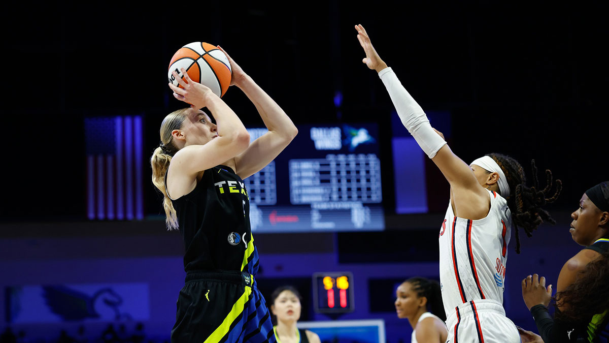 Dallas Wings guard Paige Bueckers (5) scores a basket against Washington Mystics guard Sug Sutton (1) during the second half at College Park Center.